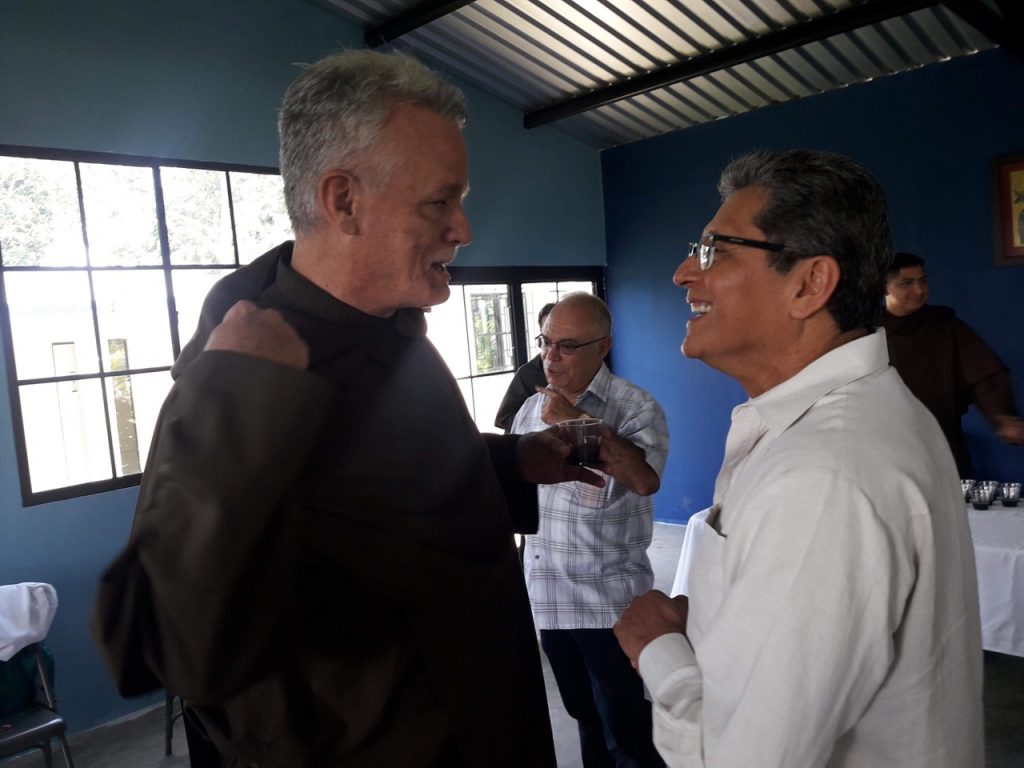 Priest and man talking