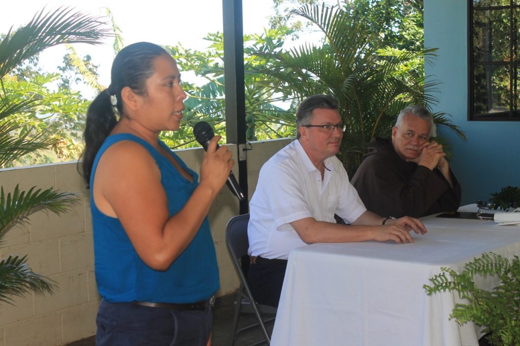 One of the women involved in the Greenhouse Project speaks to the gathering for the blessing of the greenhouses explaining how this project will affect her family and her community. Looking on are the German Consul, Norbert Eichler, and the Prior Provincial, Fr. William J. Harry, O. Carm. The German Government through its Projects of Direct Aid to Communities funded 5 greenhouses each of which is the responsibility of 5 families. The Carmelites are the assessors of the project.
